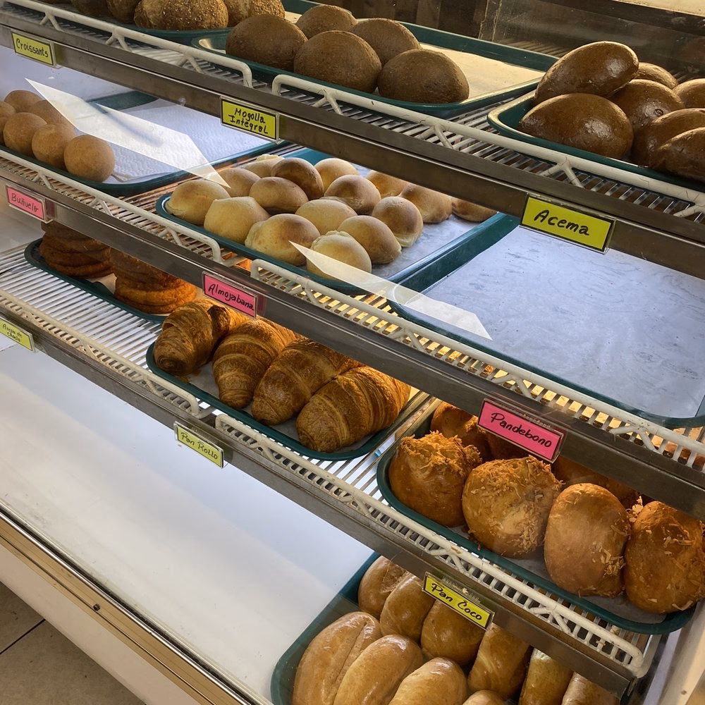 Which kind of food is sold at a baker's shop?